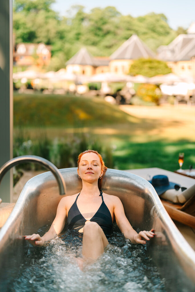 Woman bathing in an William Holland Outdoor Copper Bath