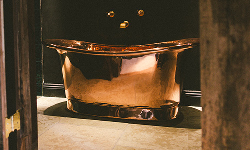 freestanding bath in a bathroom setup