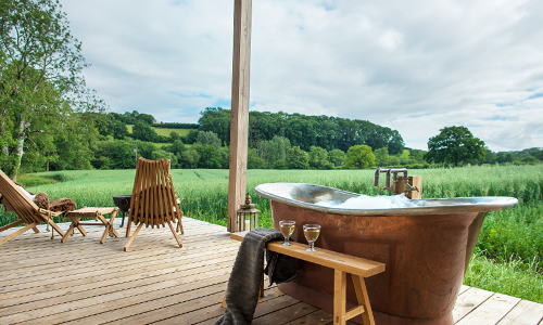 William Holland copper bath in an exterior set up